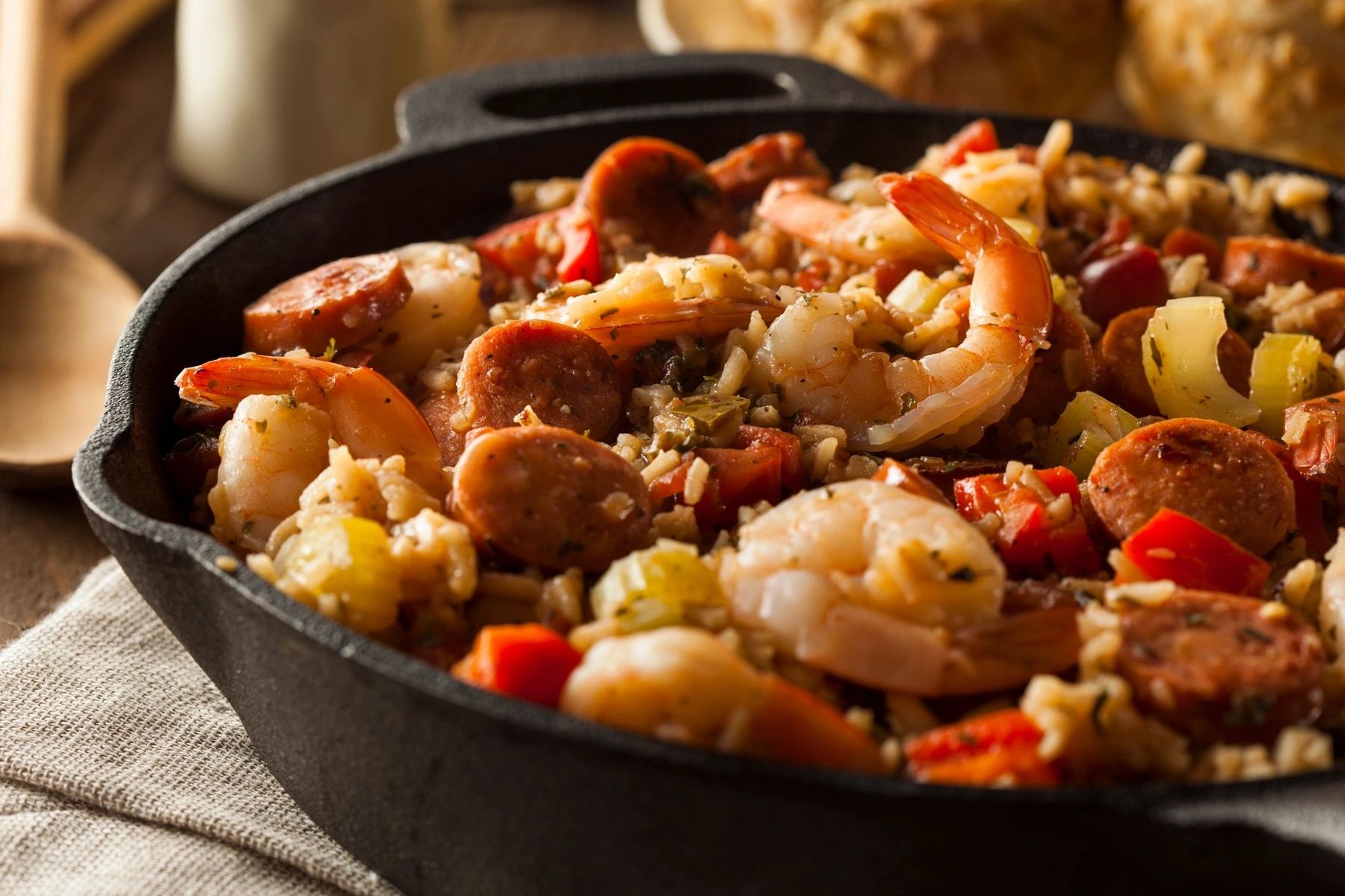 Chicken, andouille and shrimp jambalaya in a cast iron skillet